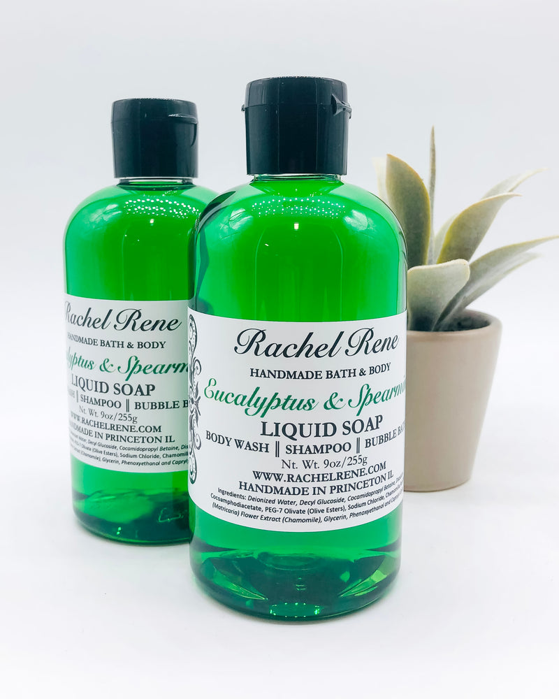 Two semi-transparent green liquid soaps with a white label that reads "Rachel Rene: Handmade Bath & Body - Eucalyptus & Spearmint. Liquid Soap - Body Wash - Shampoo - Bubble Bath." They have a black pull top cap and sit on a white background.