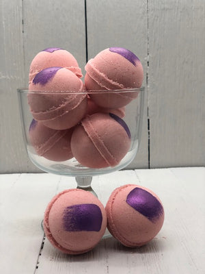 
            
                Load image into Gallery viewer, Pink bath bombs with a purple paint streak.
            
        