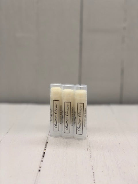 
            
                Load image into Gallery viewer, Pale yellow lip butter in a clear tube labeled &amp;quot;Butter Creme&amp;quot;
            
        