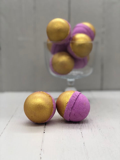
            
                Load image into Gallery viewer, Purple bath bombs half-painted gold.
            
        
